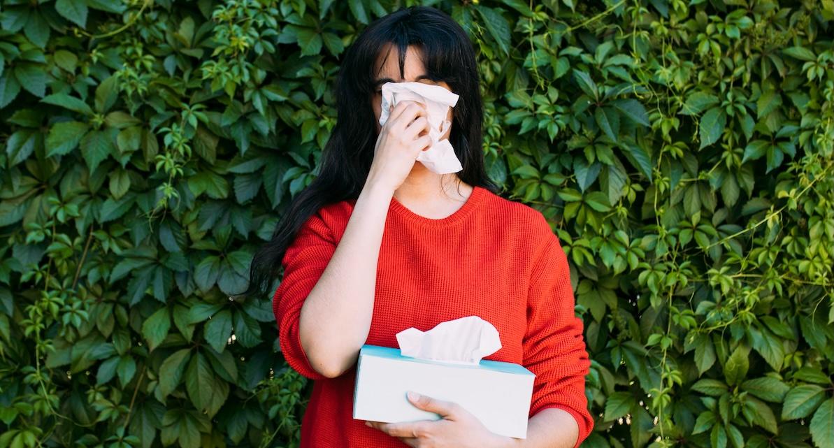woman blowing nose