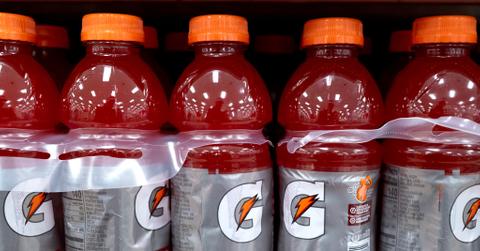 Close up of brand new red Gatorade bottles on a shelf.