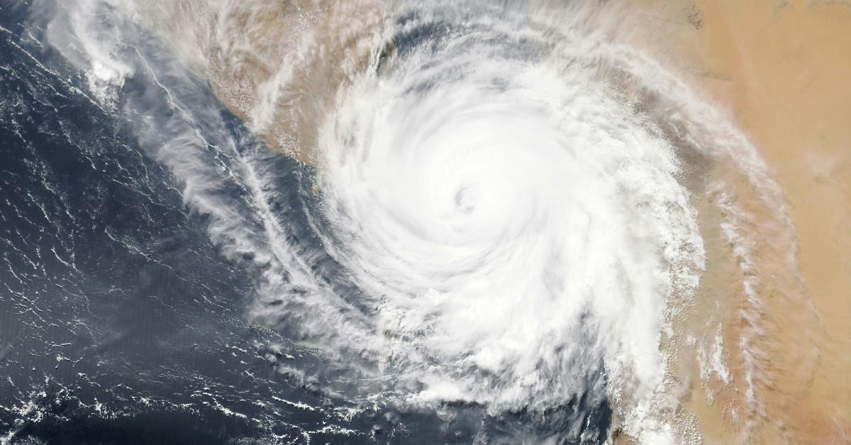 An overhead satellite shot shows a hurricane forming