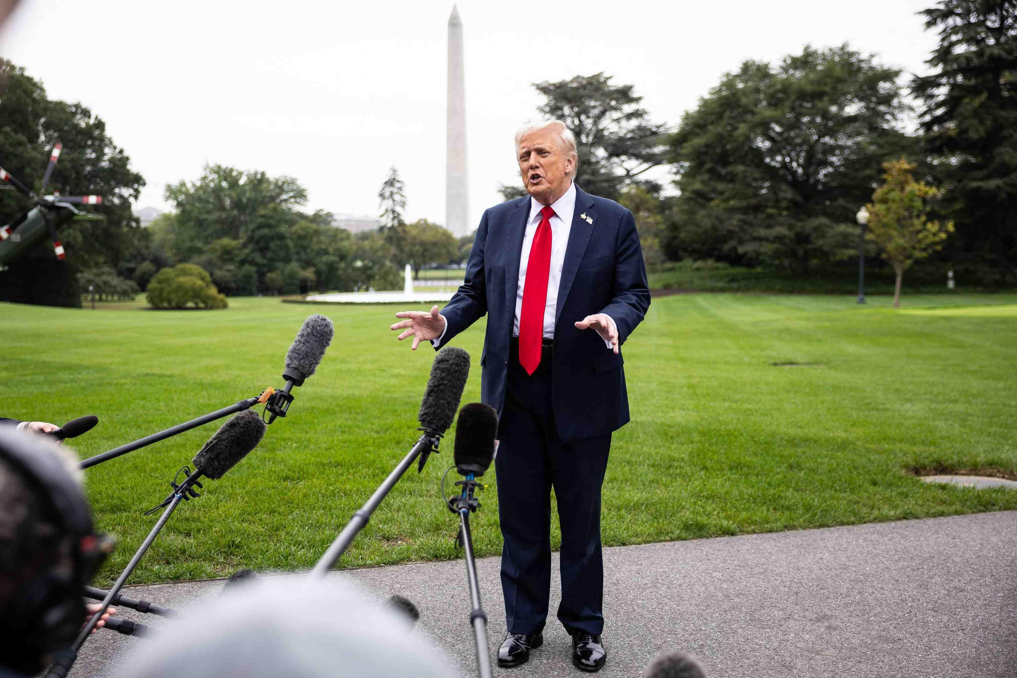 President Donald Trump speaks to reporters on the South Lawn of the White House on Sept. 30.