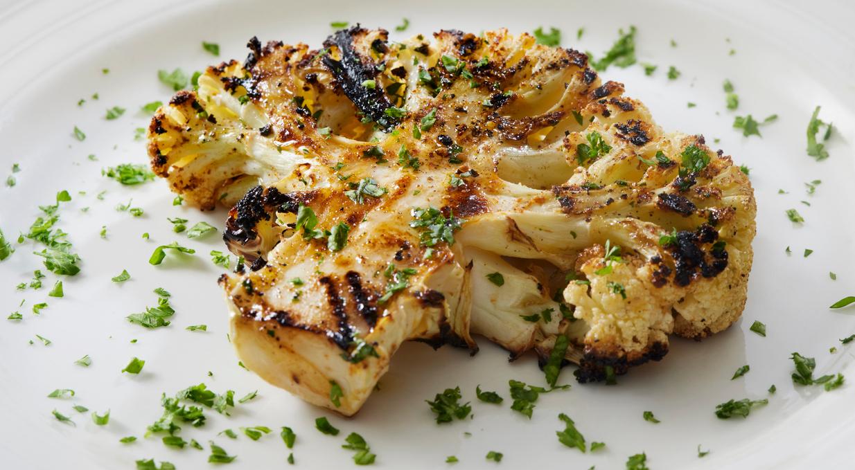 Grilled cauliflower on a white plate