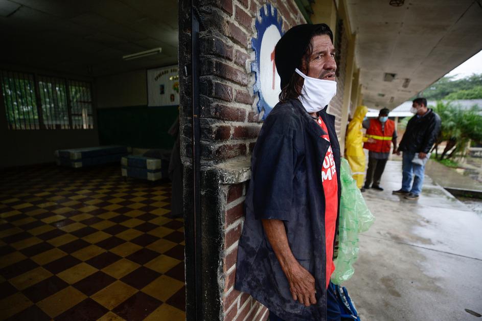 Domingo Hidalgo Navarro, an immigrant from Costa Rica, seeks refuge during Hurricane Eta