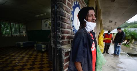 Domingo Hidalgo Navarro, an immigrant from Costa Rica, seeks refuge during Hurricane Eta