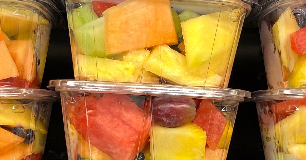 Photos of boxes of pre-cut fruit including cantaloupe in stores.