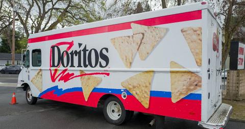 Photo of a white Doritos truck parked on a street
