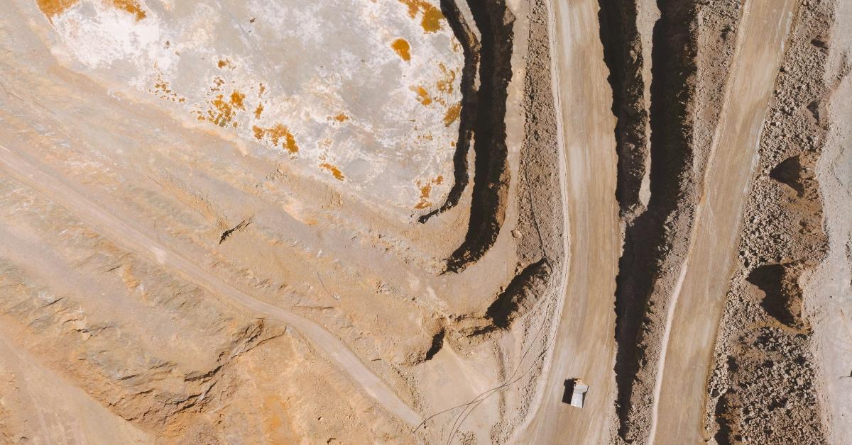 Arial view of mining truck traveling to a rare mineral mine. 