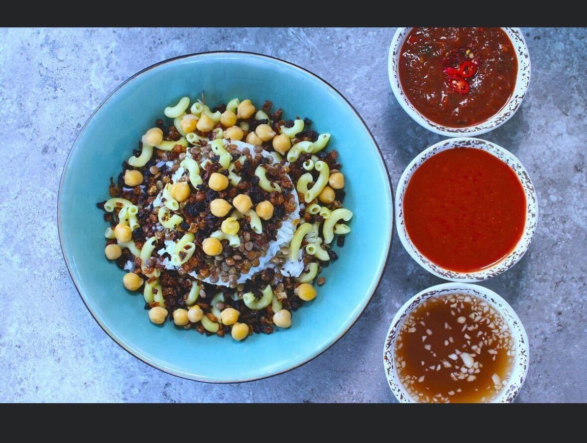 A dish with sauces at Koshari Mama in Boston, Massachusetts