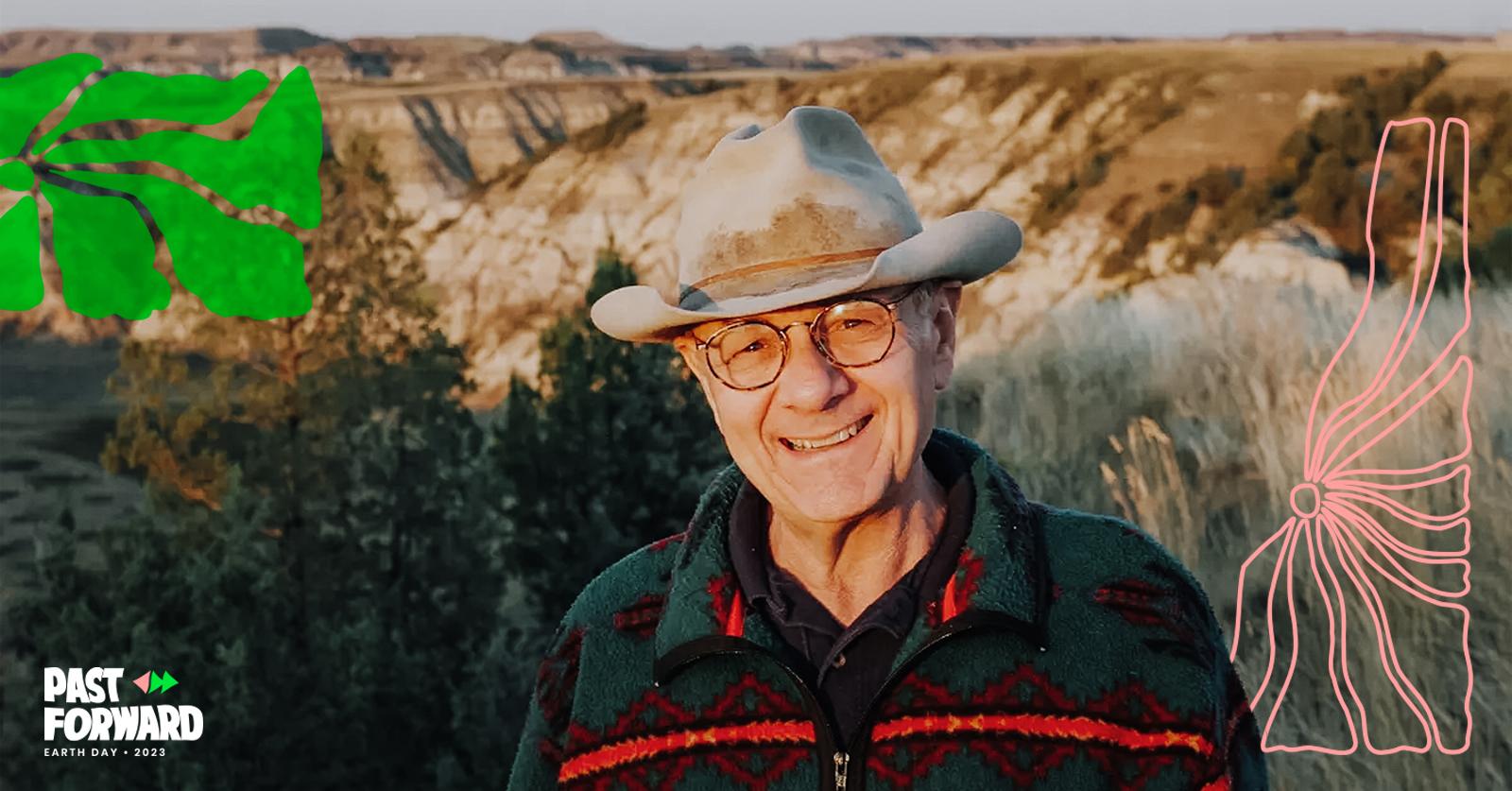 Lowell Baier in a hat, in front of a rock formation.