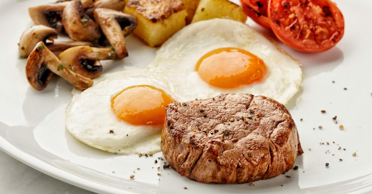 A closeup of steak and eggs