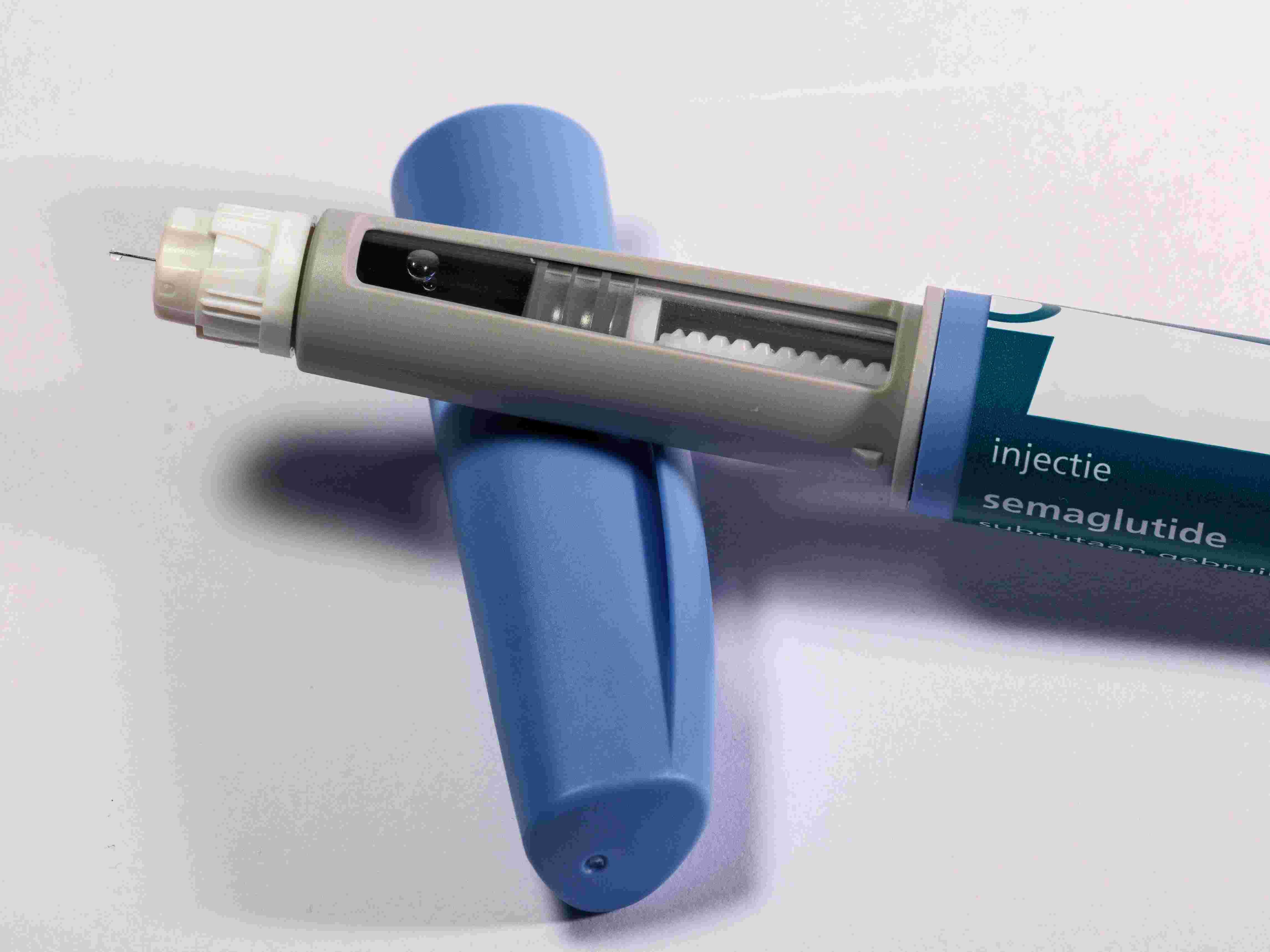 A Semaglutide injectable pen is pictured atop a table.