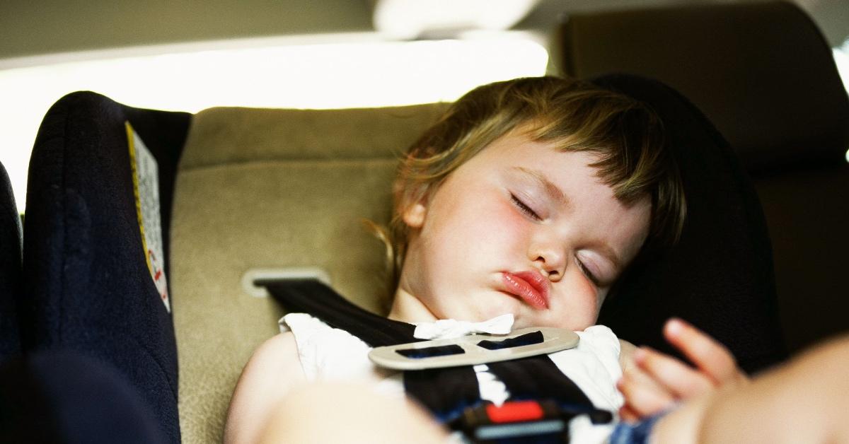 A child rests in a car seat that may or may not contain flame retardants.