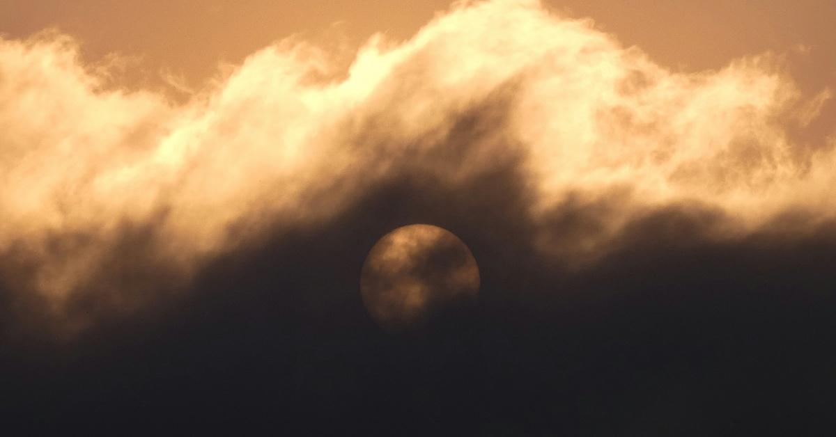 Full moon covered by wildfire smoke. 