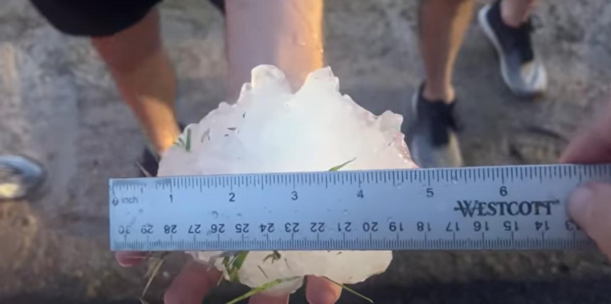 hail stone with a ruler to measure 5 inches