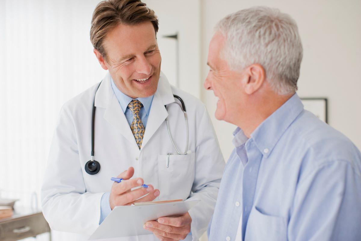 Man speaking to a doctor at the doctor's office