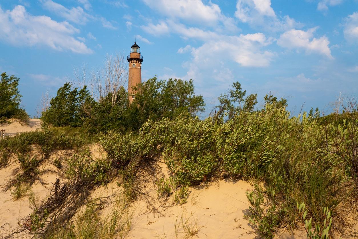 Little Sable Point Lighthouse near the sandy shore of Lake Michigan at Silver Lake State Park.