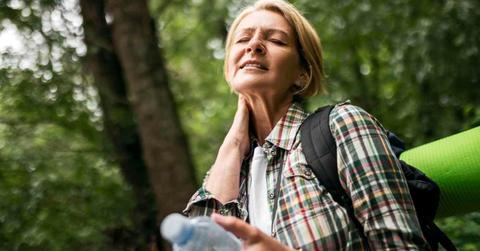 Woman hiker in woods tormented by mosquito bite (Representative Cover Image Source: Getty Images | Zorica Nastasic)