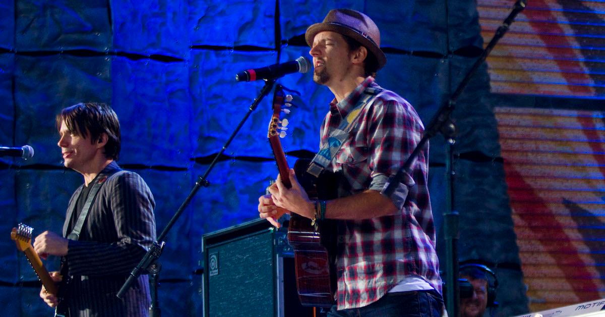 Jason Mraz and another man play guitars and sing into mics at Farm Aid 25: Growing Hope for America at Miller Park on Oct. 2, 2010 in Milwaukee, Wis.