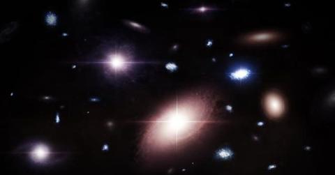 This artist’s conception captures a snapshot of galaxy sizes and the frequency of black holes within them. (Cover Image Source: CfA/Melissa Weiss)