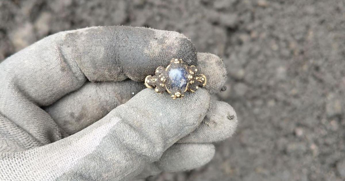 Norwegian archaeologist found a gold sapphire ring entombed seven centimetres deep into the soil (Cover Image Source: Facebook | Norwegian Institute for Cultural Heritage Research)