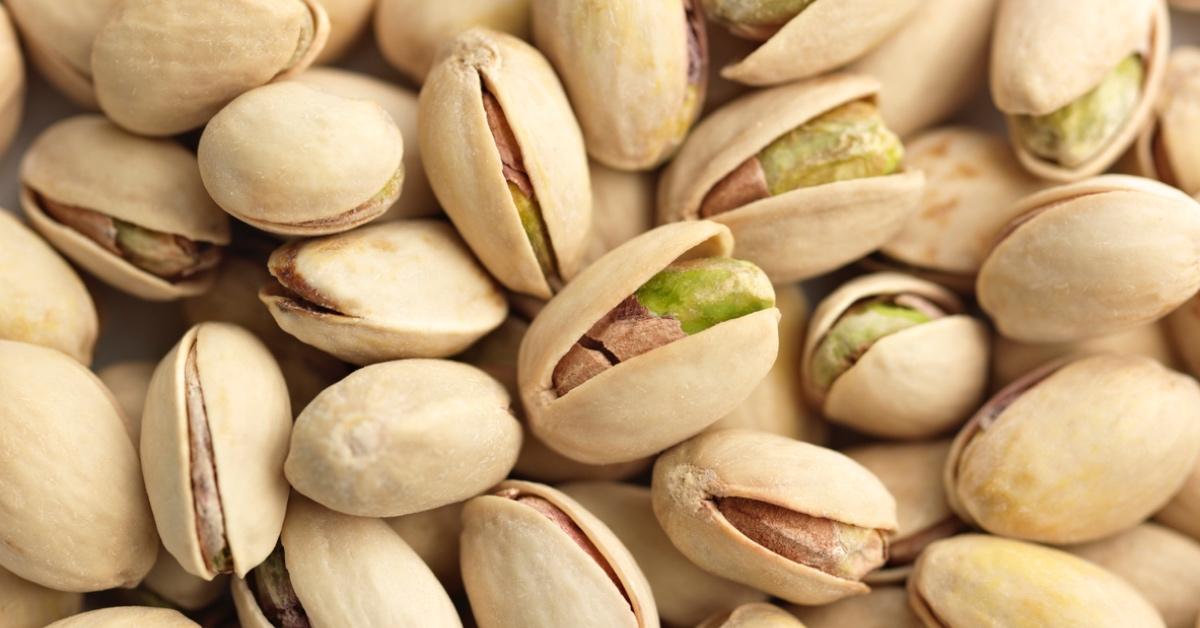 Close-up photo of pistachios in shells.