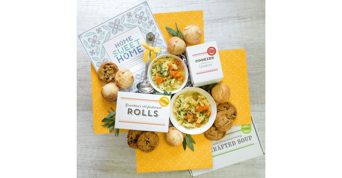 vegan soup, rolls, and cookies and cookbooks in yellow and white box