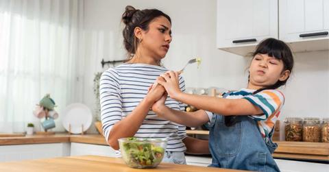 Mother begs young daughter to eat green vegetables but the child refuses abruptly. (Representative Cover Image Source: Getty Images | Kiwis)