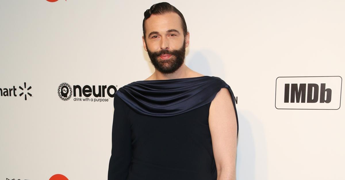 Jonathan Van Ness smiles into the camera waring a black dress