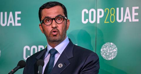 Sultan Al Jaber speaks in front of green COP278 backdrop