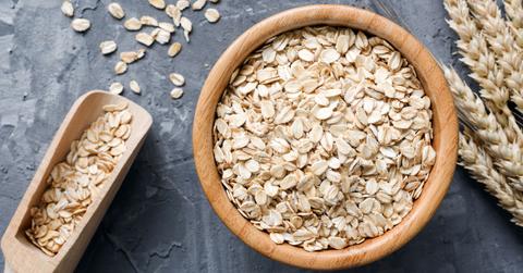 Bowl of oats on a gray table.