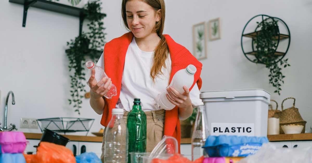 A woman is sorting the plastic waste in the garbage pile at home. (Representative Cover Image Source: Pexels | Shvets Productions)