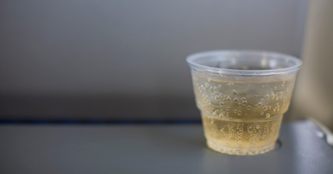 A cup of ginger ale sits on a table