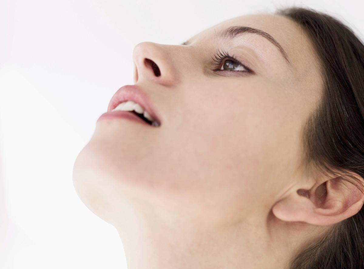 Woman gargling with salt water