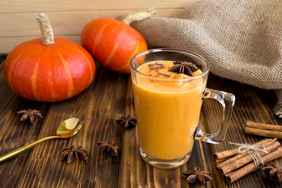 Fall table arrangement with pumpkin beverage.