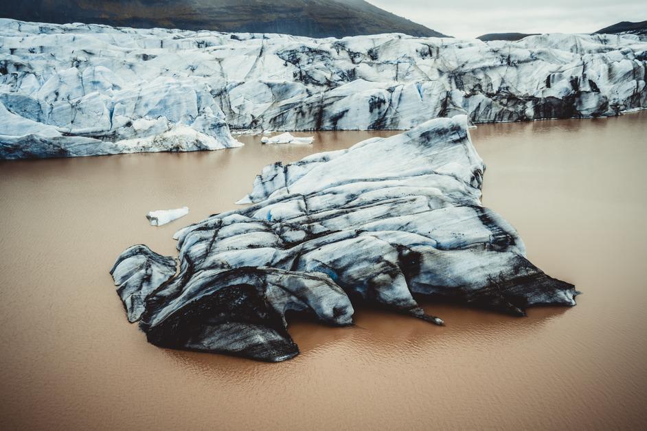 Iceberg in dirty water