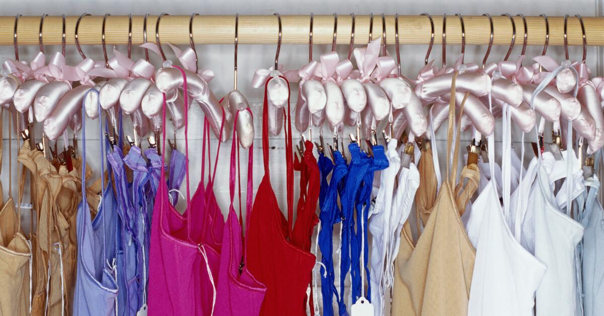 Photo of lingerie and camisoles hanging on clothes rack