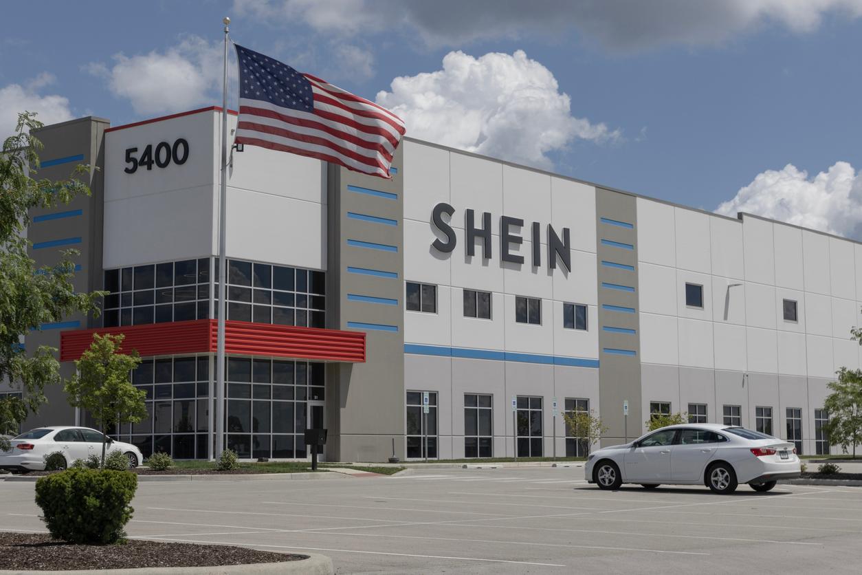 A SHEIN building is depicted with an American flag waving beside it.