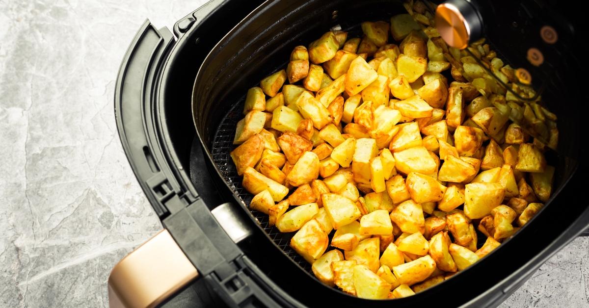 Air fryer making baked potatoes.