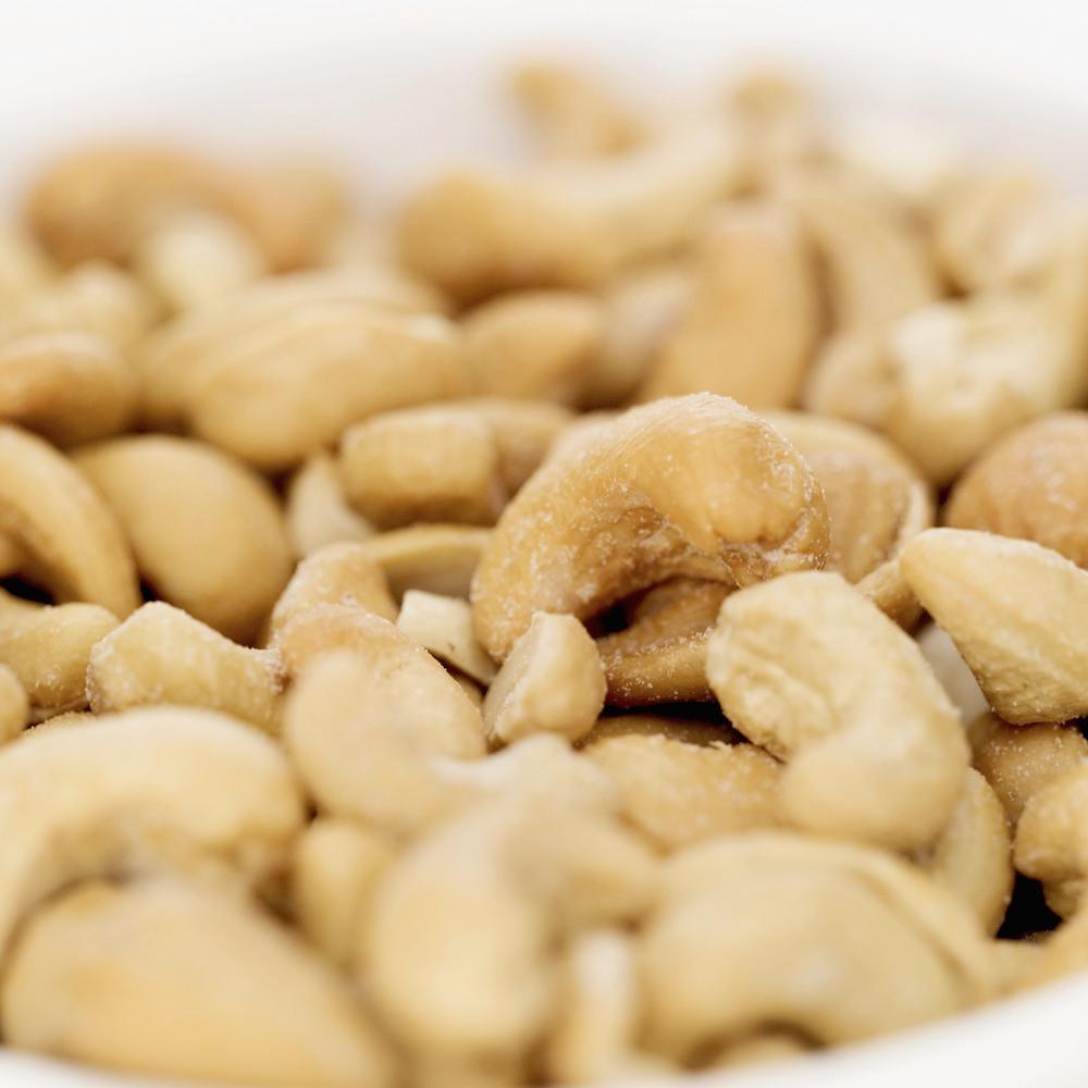 A close up of a bowl of cashews. 