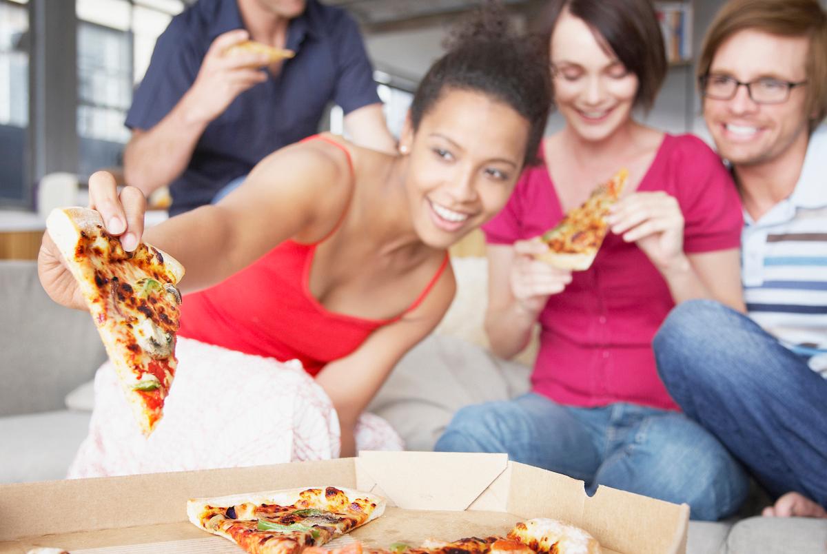 Friends enjoying pizza