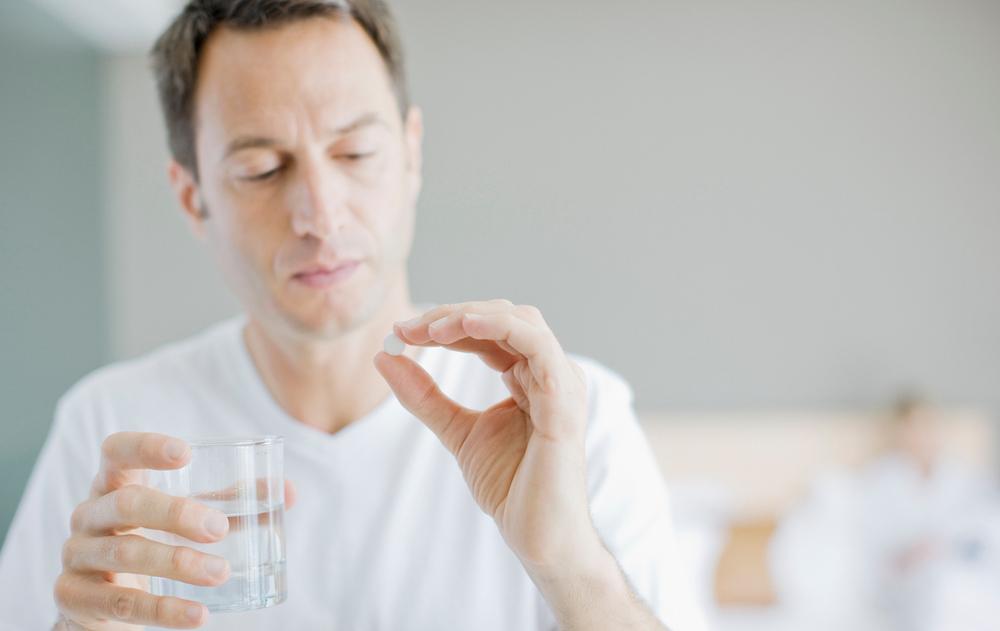 Man Taking Medication