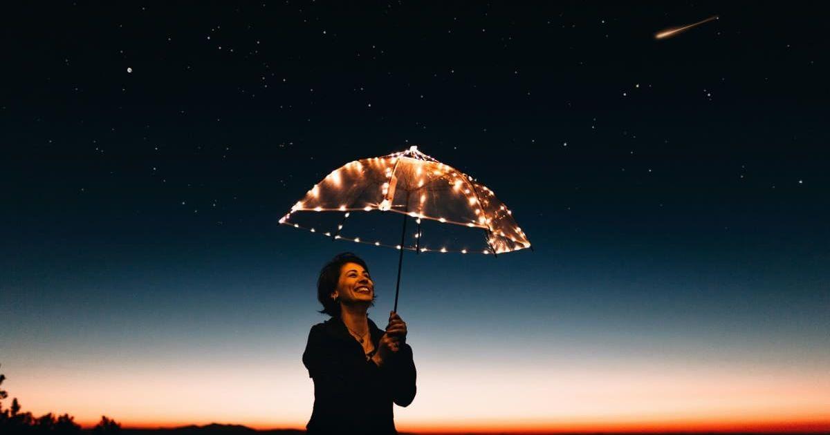 A person watching shooting stars in the night sky. (Representative Cover Image Source: Pexels | Matheus Bertelli)