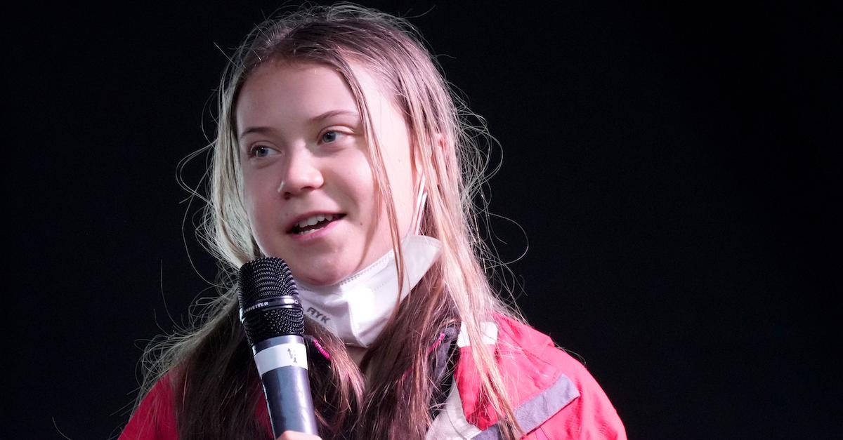 Greta Thunberg speaks into a microphone