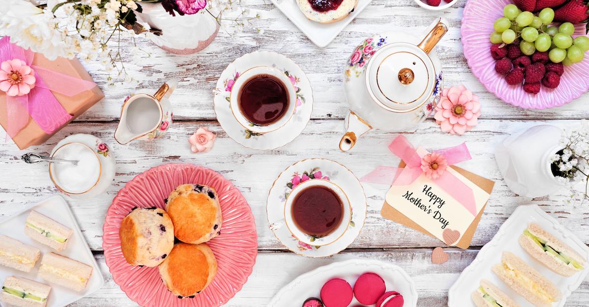 A brunch spread on a white wooden background.