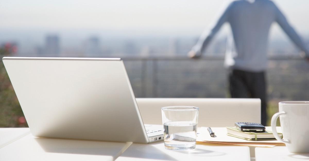 Person doing remote work from their balcony. 