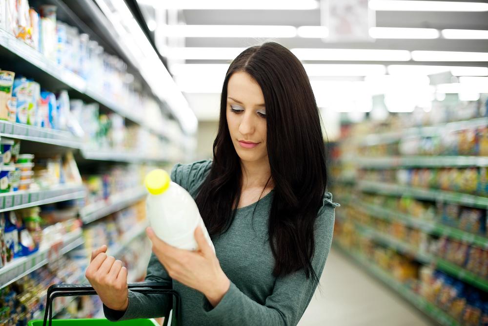 Woman Buying Milk