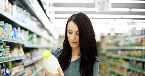 Woman Buying Milk