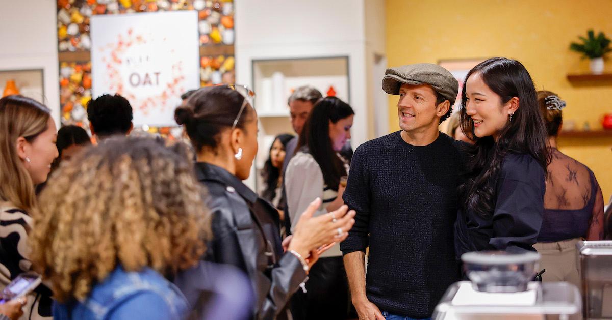 Jason Mraz poses with a fan during Planet Oat's Barista Lovers Coffee House with Jason Mraz at Chelsea Market on Jan. 25, 2024 in New York City.