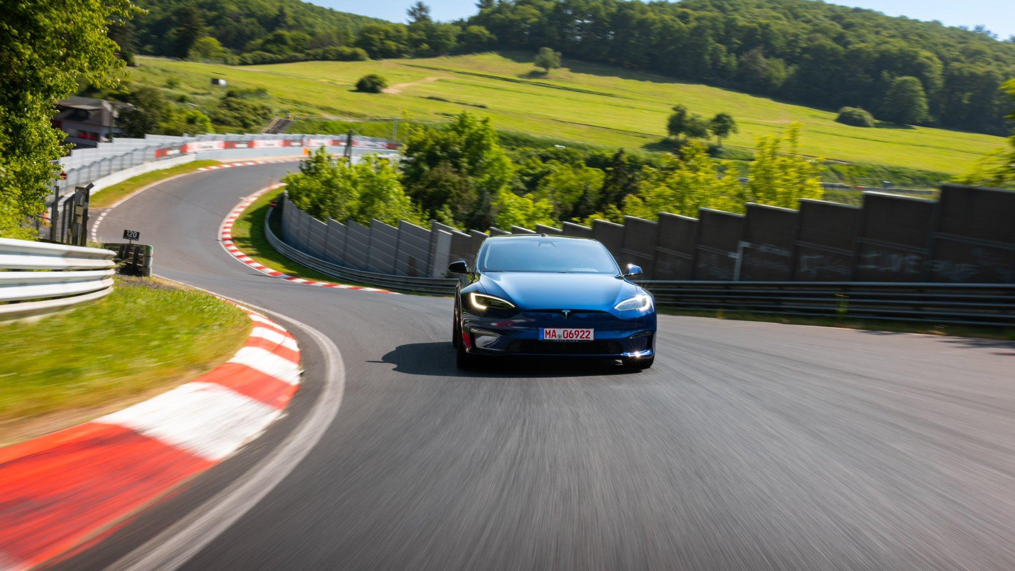 The Tesla Model S Plaid driving on a track