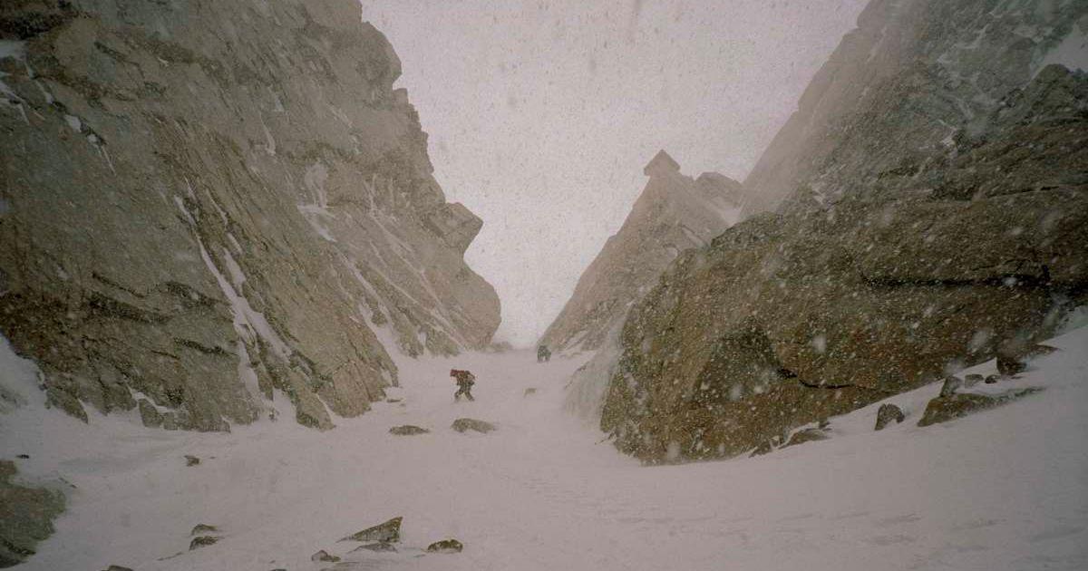Two travellers hiking on a snow-covered mountain gully during a snowstorm (Representative Cover Image Source: Getty Images | Aaron Black)