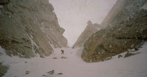 Two travellers hiking on a snow-covered mountain gully during a snowstorm (Representative Cover Image Source: Getty Images | Aaron Black)